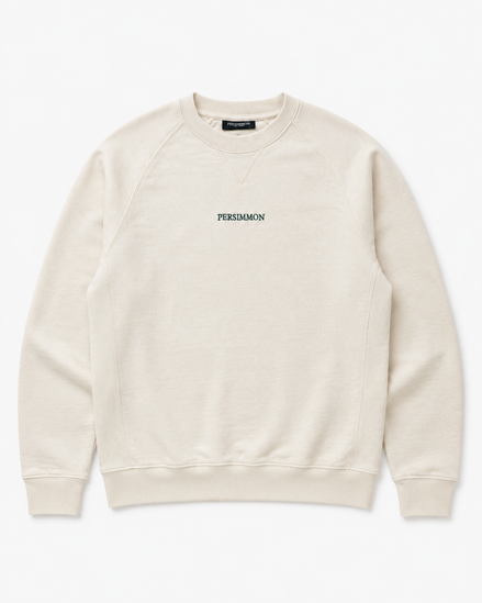 Cream sweatshirt with 'Persimmon' branding on a white background