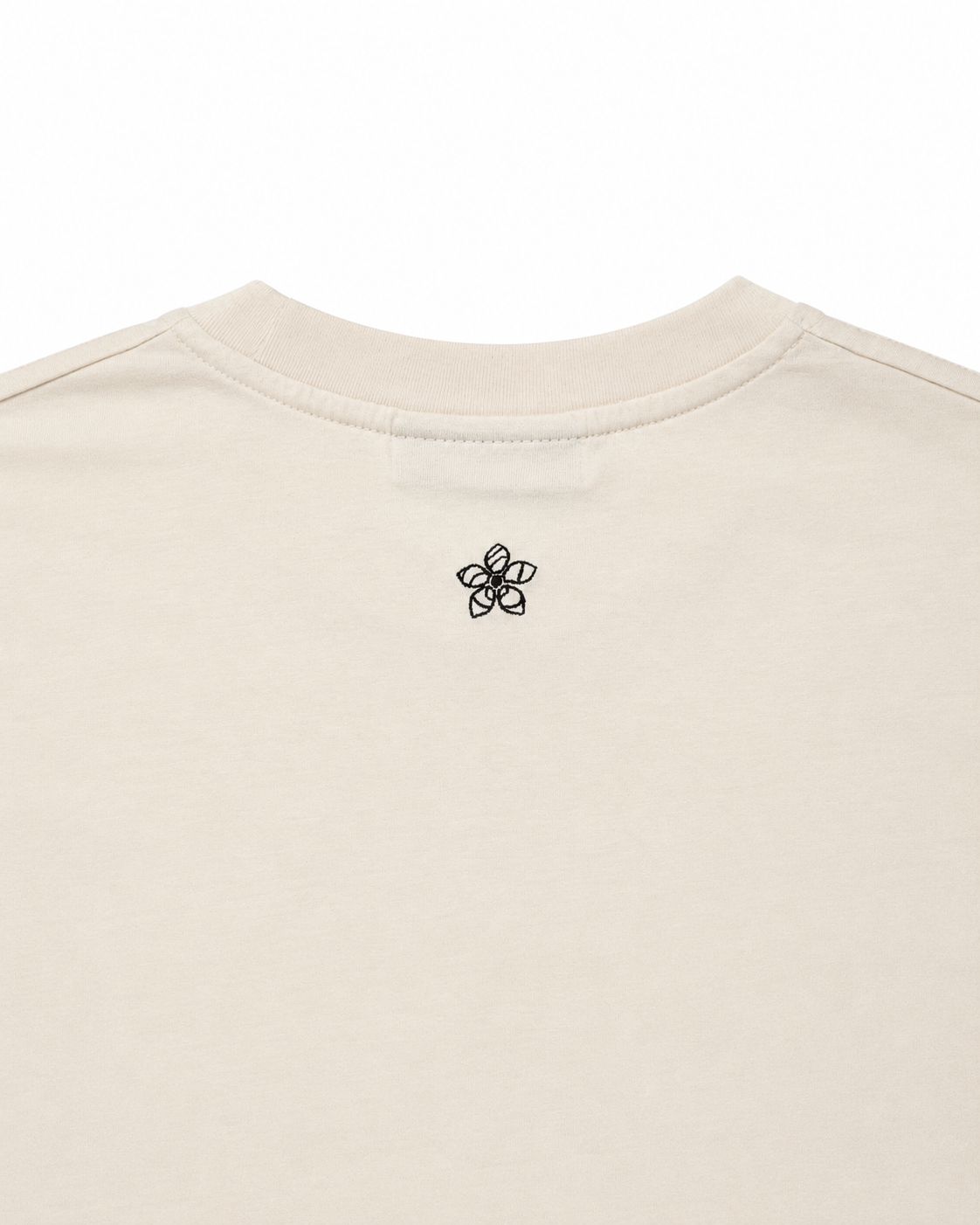 Cream t-shirt with a dark green embroidered Persimmon emblem design on a white background