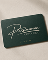 Dark green bank card sized card with Persimmon Apparel logo