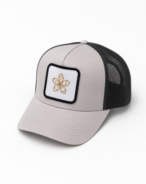 Trucker hat with a Persimmon logo patch on a white background