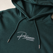Green hoodie with 'Persimmon Apparel' logo on a neutral background
