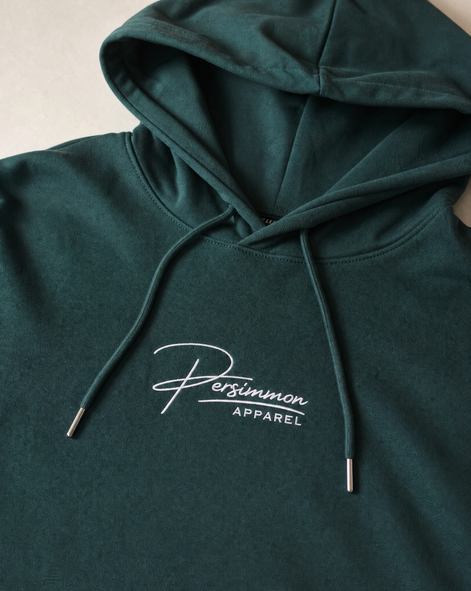 Green hoodie with 'Persimmon Apparel' logo on a neutral background